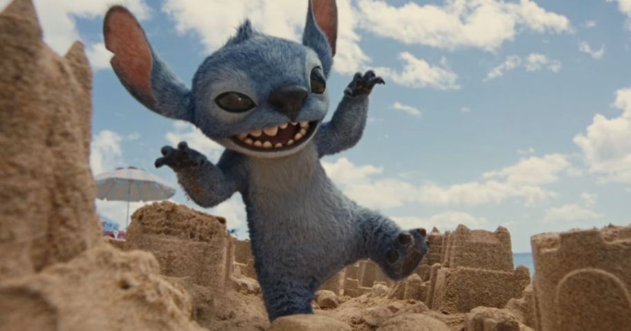 stitch walking on sand castle on beach