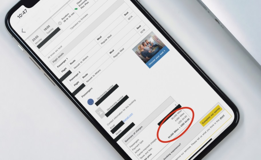 phone with cheap flight booking on screen