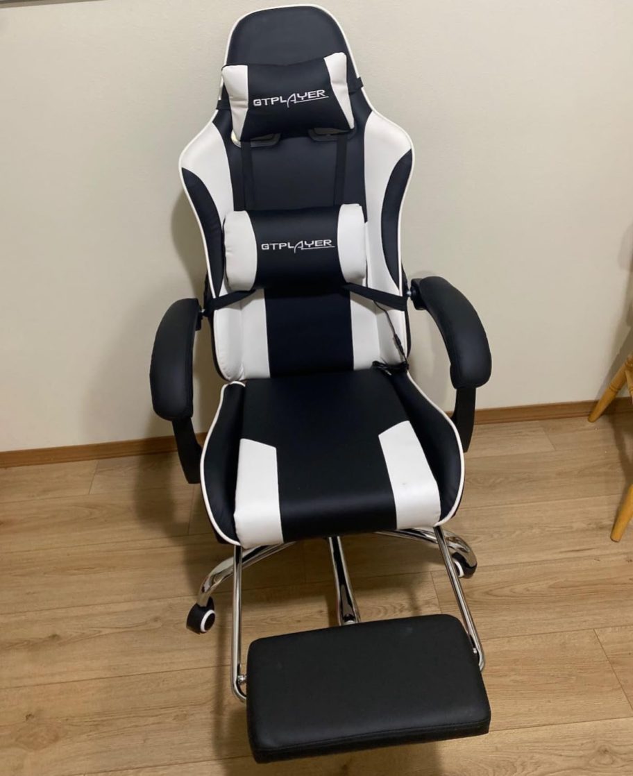 black and white gaming chair with foot stool