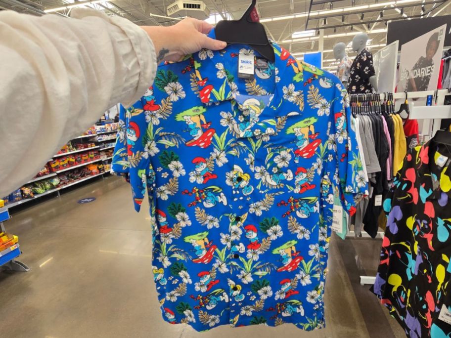 blue Smurfs Men's Hawaiian Shirt in hand in store