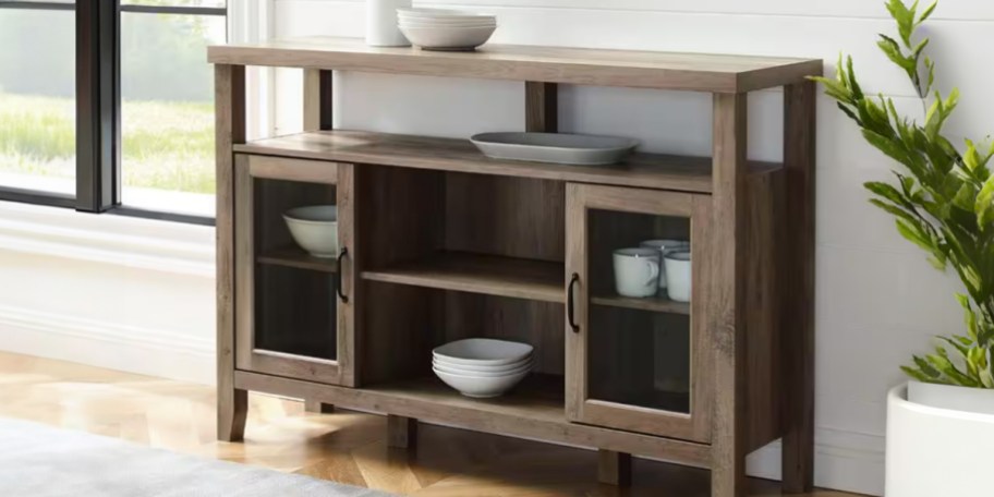 brown buffet table with dishes inside