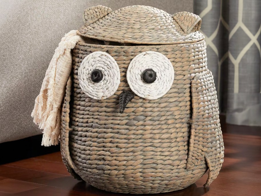 owl storage basket with blanket hanging out 