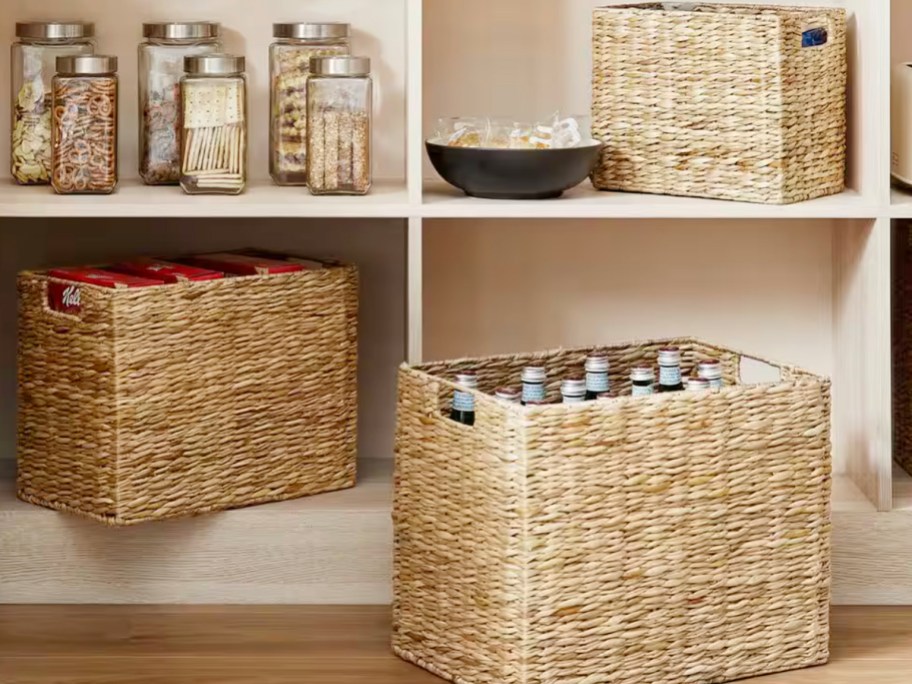 wicker baskets in pantry full of foods 