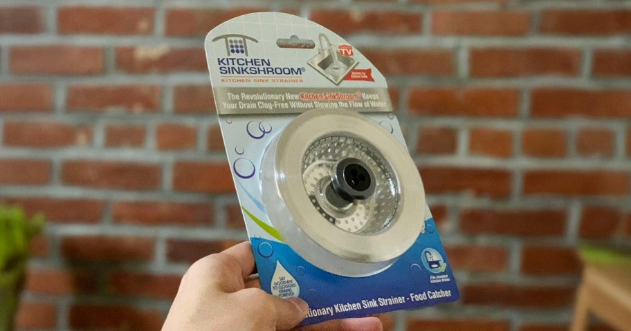 hand holding sink strainer