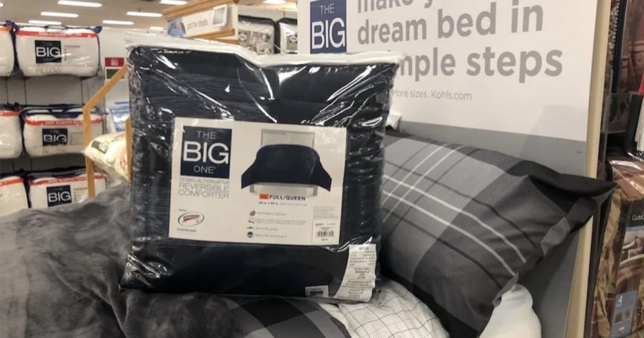 kohls the big one comforter bag sitting on bed in store 