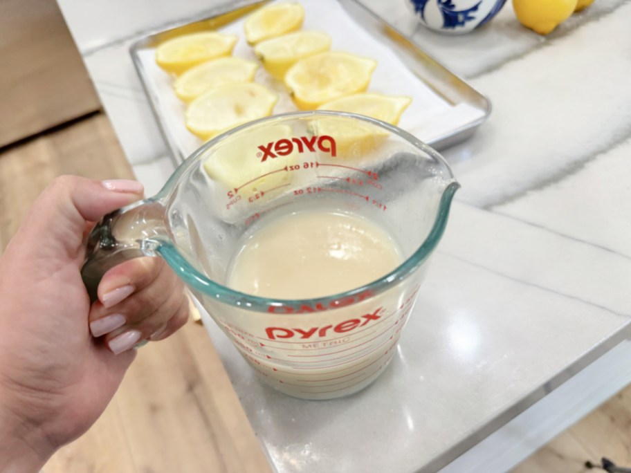 lemon sorbet in liquid measuring pyrex cup