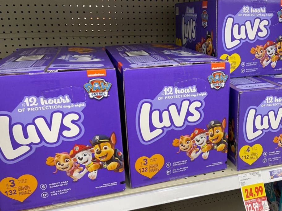boxes of luvs diapers on shelf at store