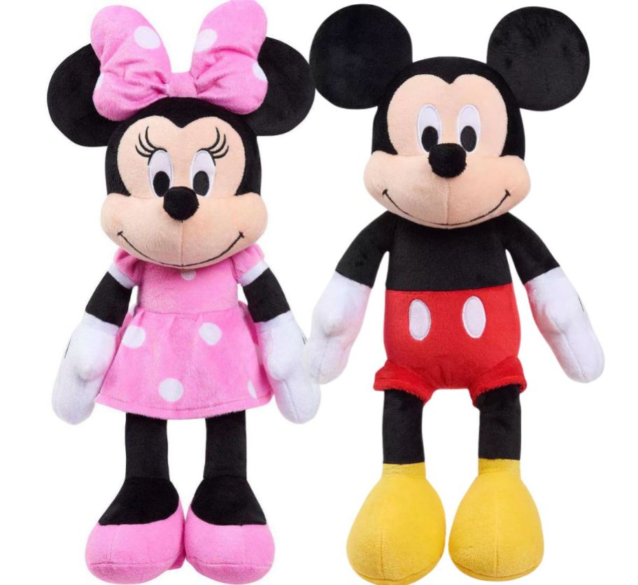 a minnie mouse plush doll in a pink dress shown with a mickey mouse plush doll in red shorts