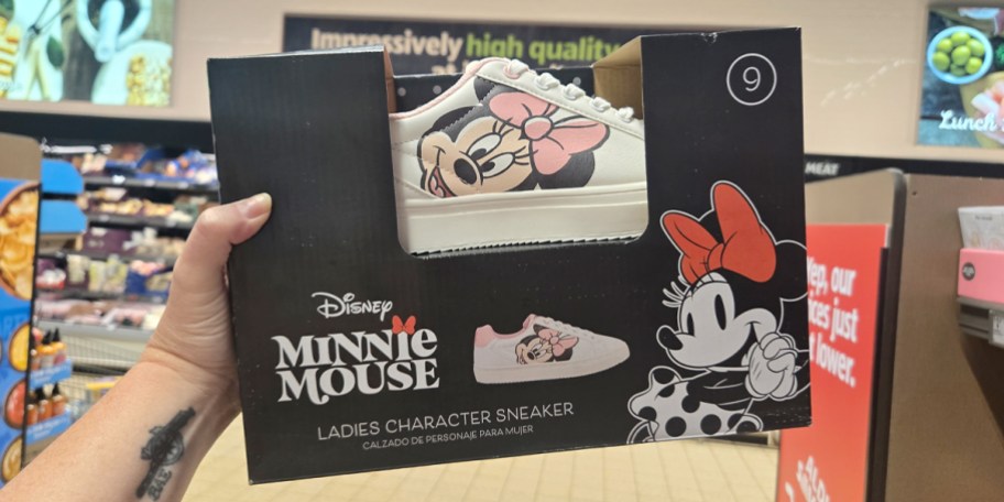hand holding disney sneaker