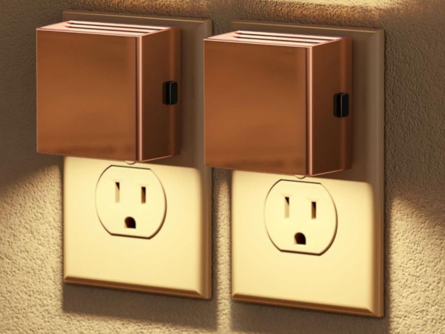 two square rose gold night lights in outlet on wall