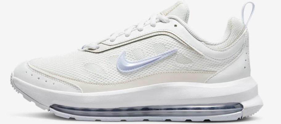 white and light purple nike shoe