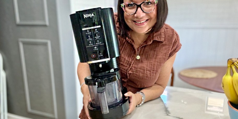 woman holding ninja creami machine