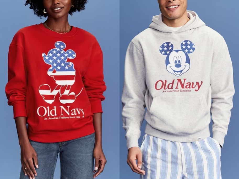 woman wearing a red Old Navy Disney sweatshirt and man wearing a grey Disney Old Navy hoodie