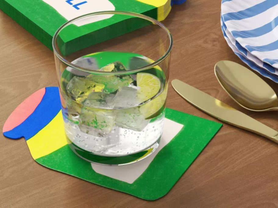 Room Essentials Pickle Jar Figural Napkin underneath drink on table
