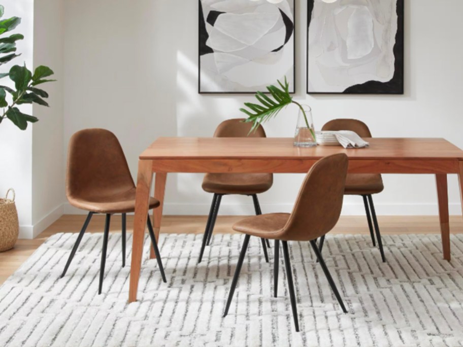 faux leather chairs next to table