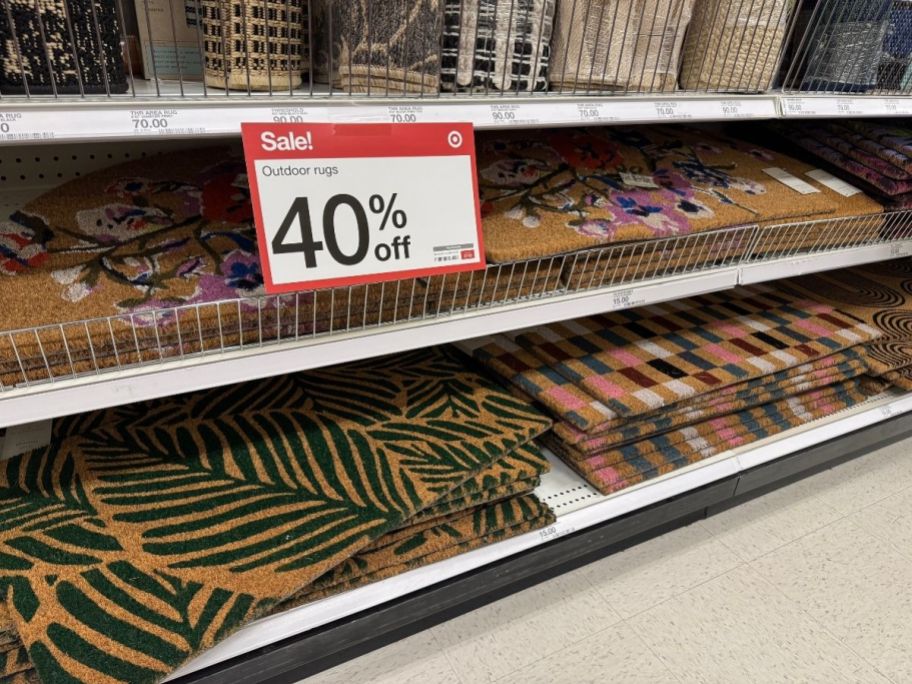 a selection of doormats on a store shelf