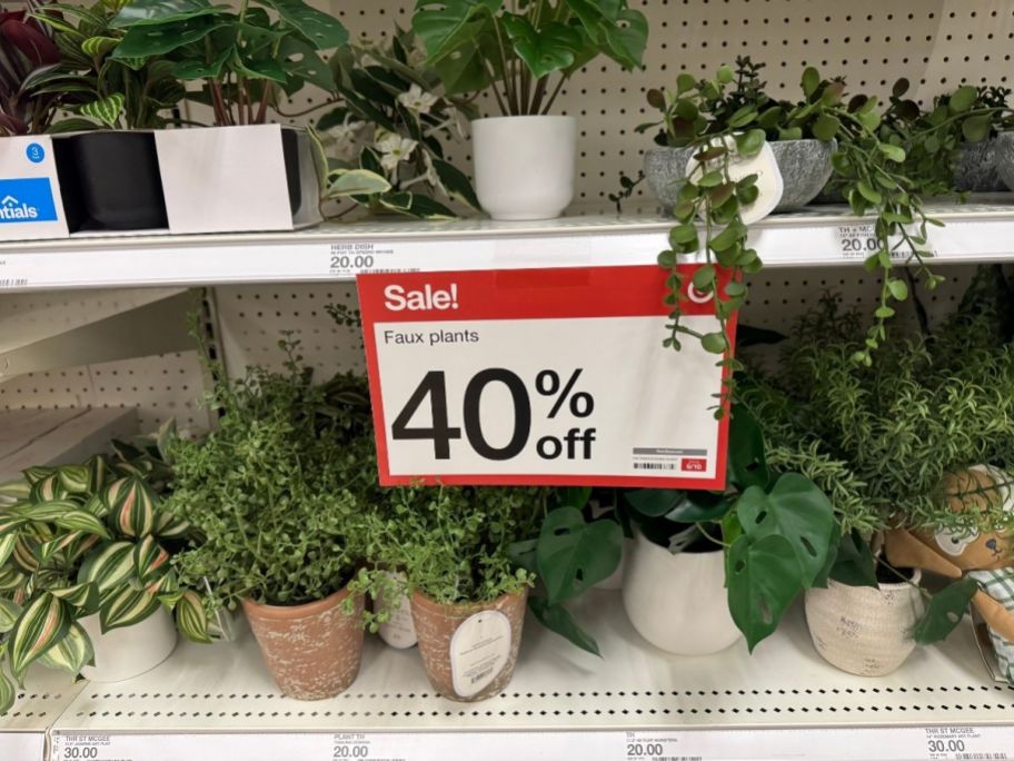 a selection of artificial houseplants on a store shelf