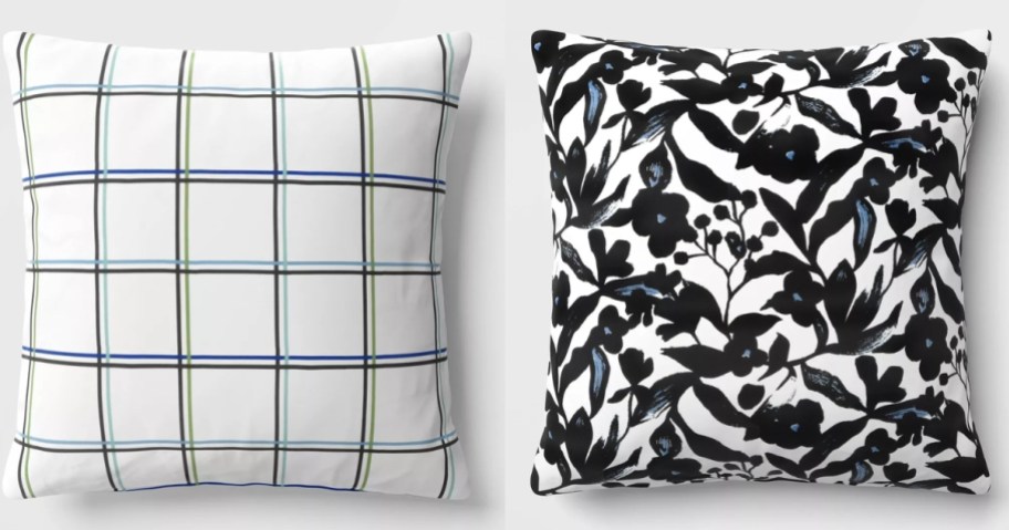 a white and blue checked throw pillow and a black floral throw pillow