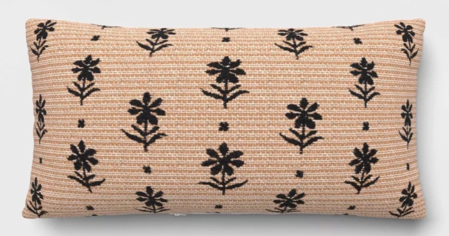 a tan and black floral print rectangle throw pillow