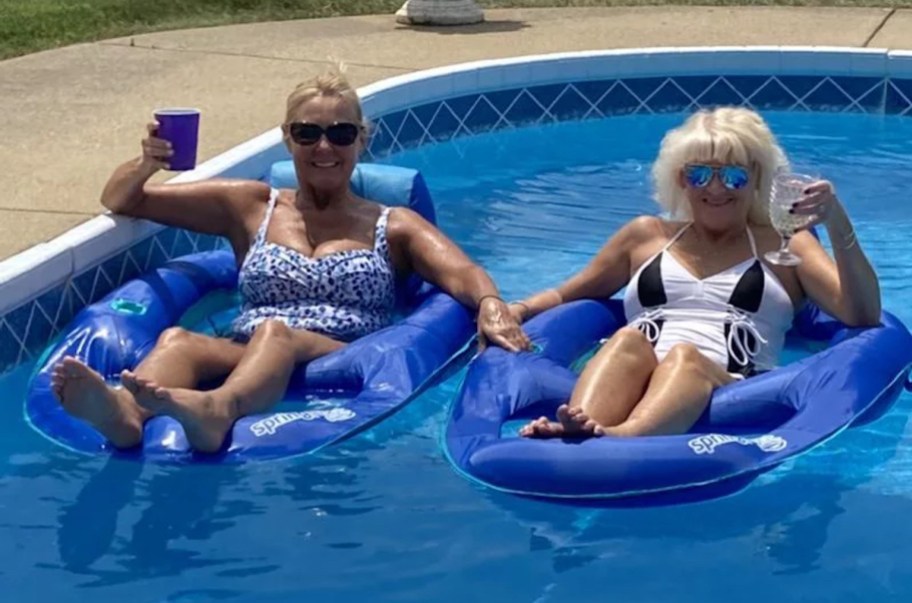 two women floating on pool float