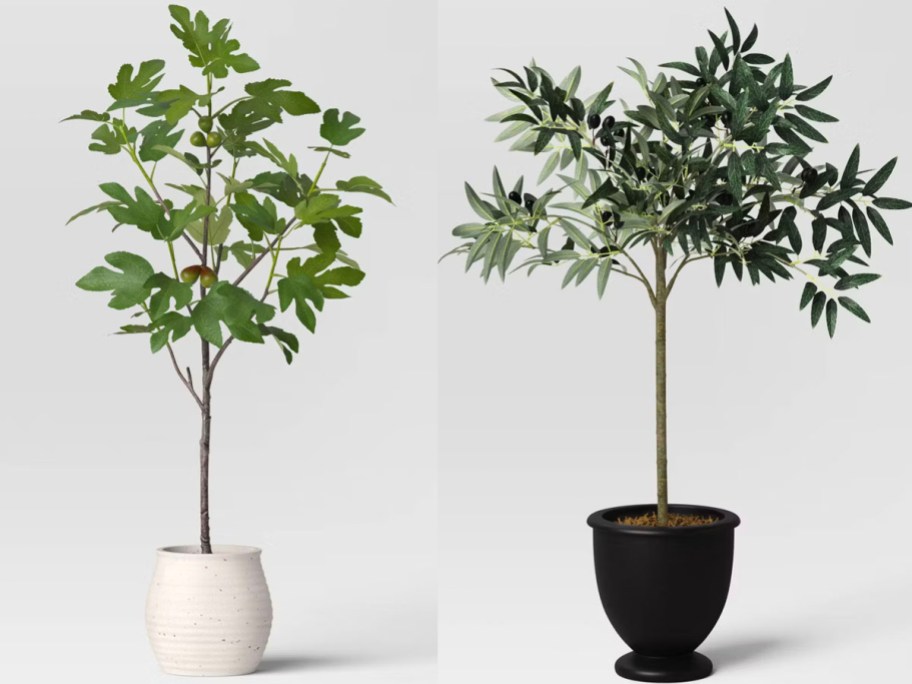 two artificial trees in white and black pots 