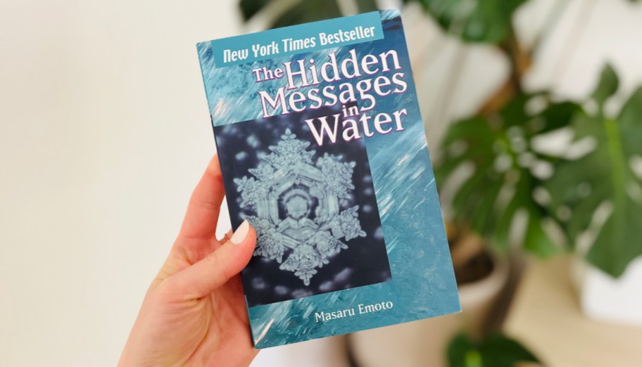 hand holding a book about the hidden messages in water