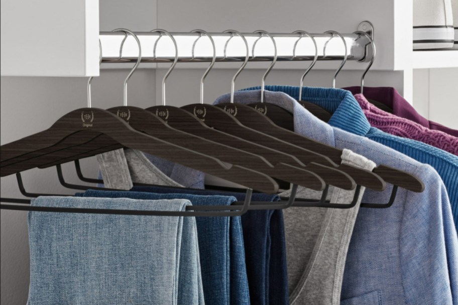 dark brown clothes hangers in closet