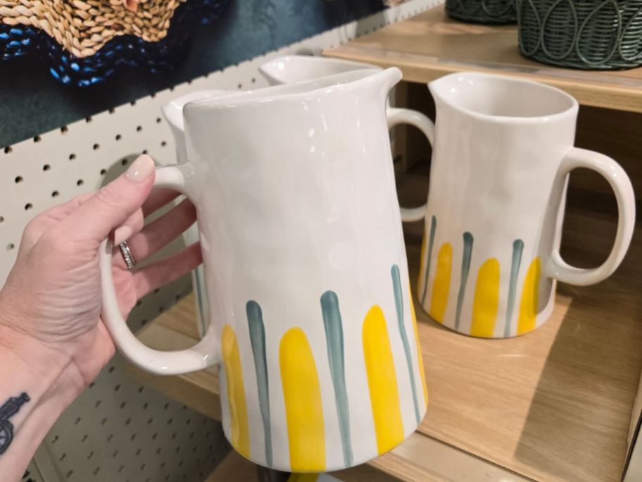 white, blue, and yellow Threshold Large Pitcher in hand in store