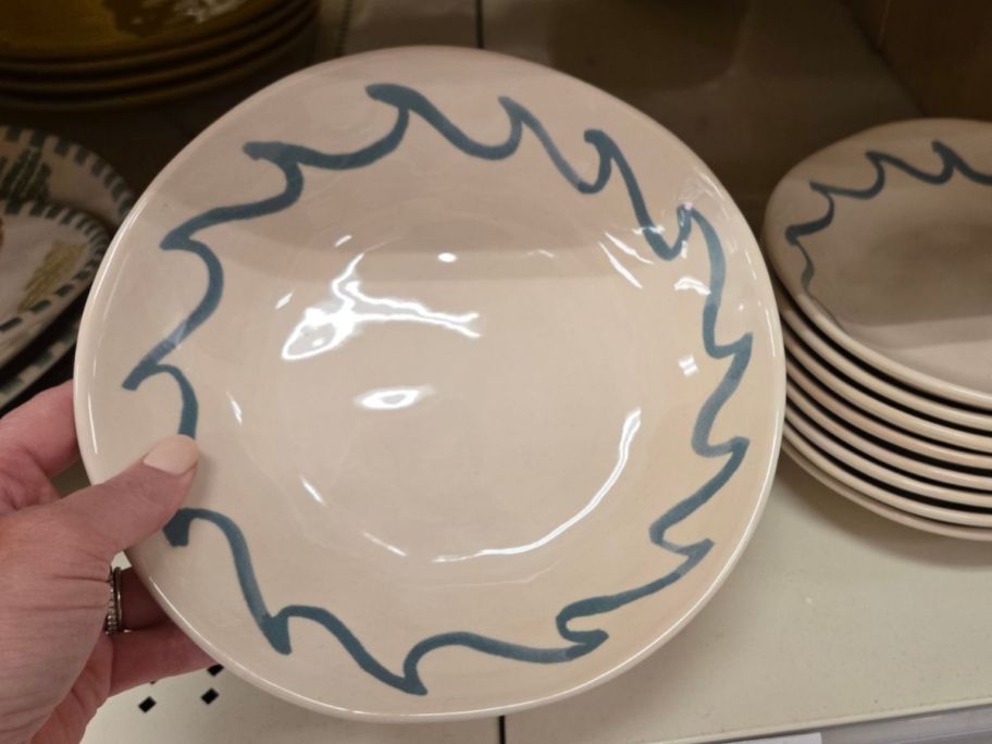 blue and white Threshold Stoneware Dinner Bowl in hand in store