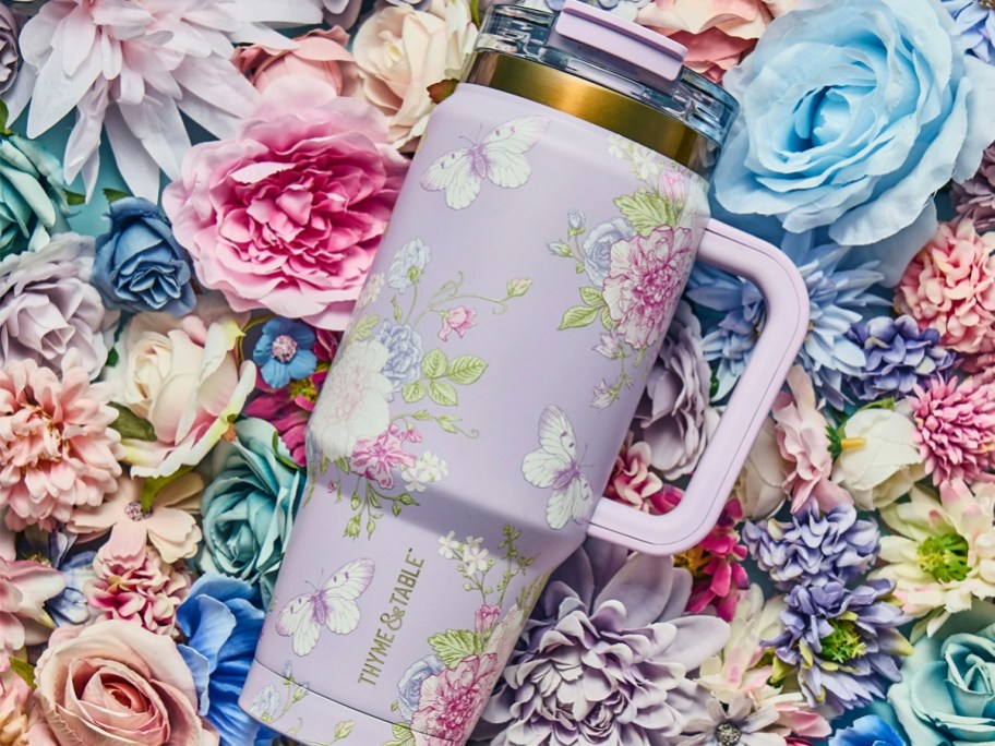 purple butterfly tumbler on flowers