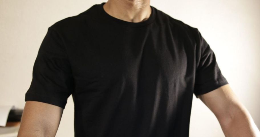 man wearing black amazon essentials t-shirt