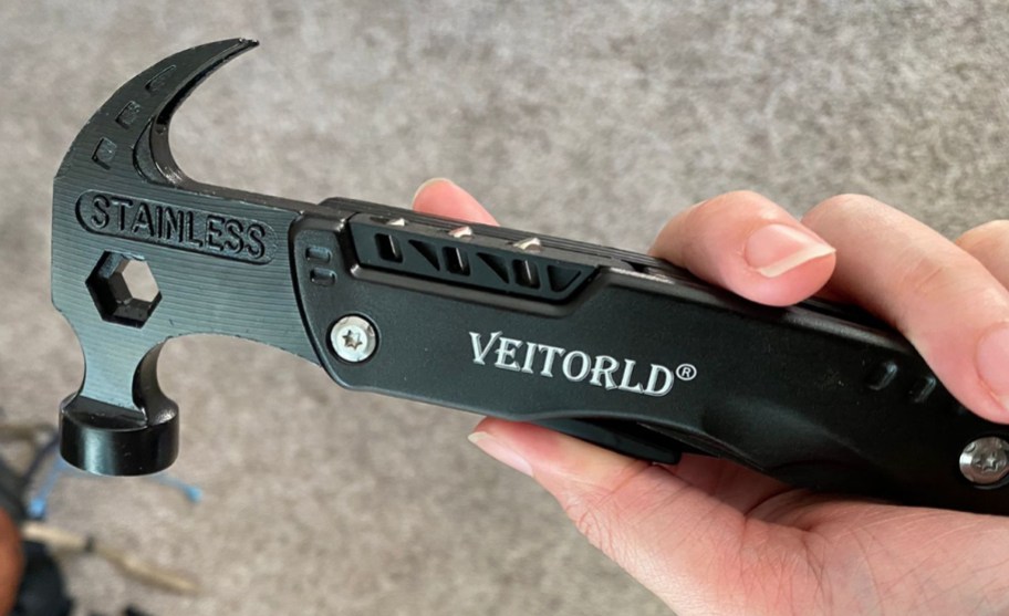 hand holding multitool hammer