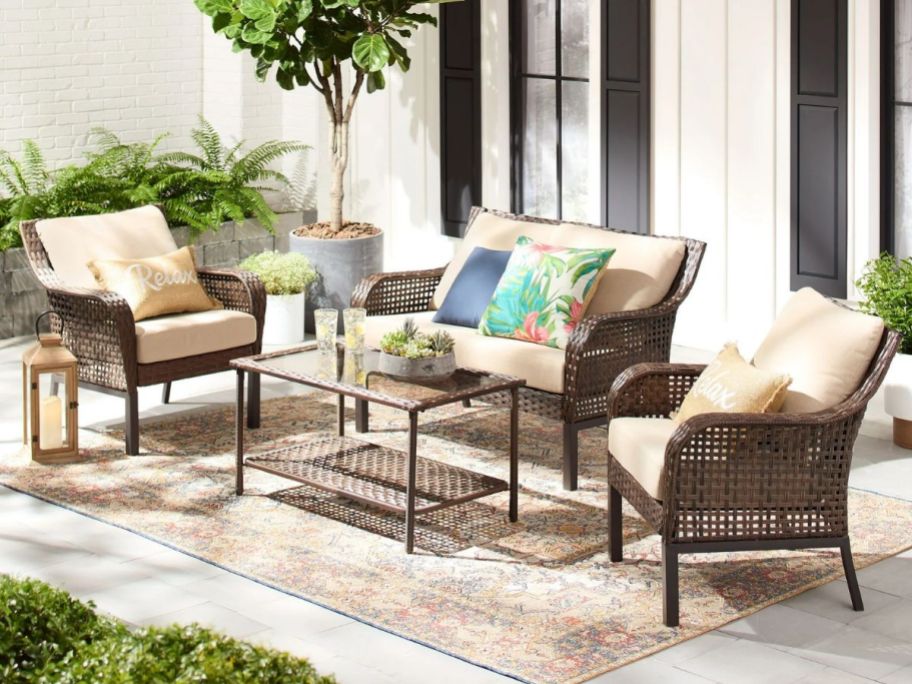 Patio with Mainstays Tuscany Ridge 4-Piece Wicker Outdoor Conversation Set wwith two chairs, a coffee table and a loveseat