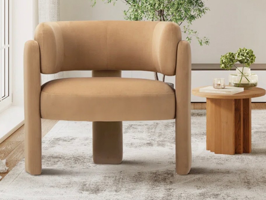 tan barrel chair next to table