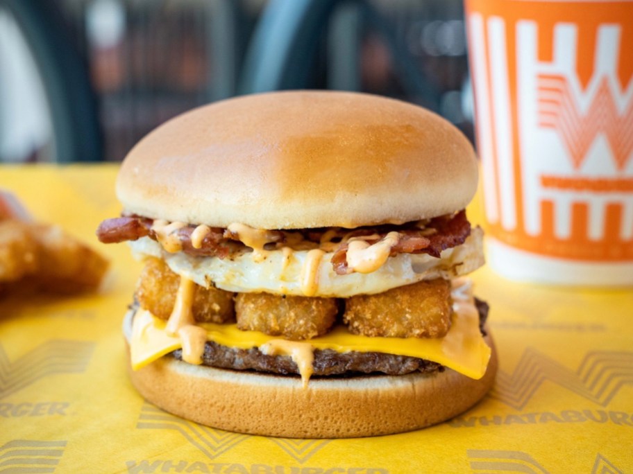 breakfast burger with drink on table