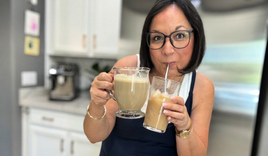 woman drinking protein coffee from a straw