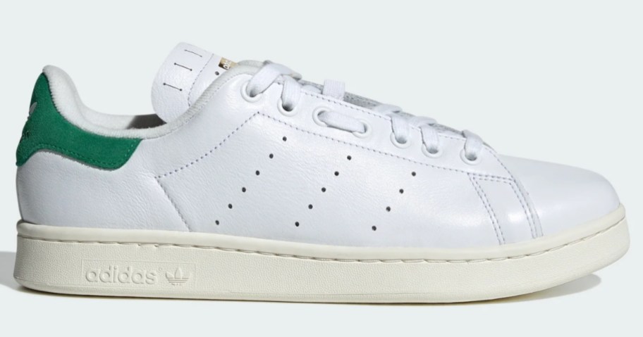 a white and green adidas men's shoe