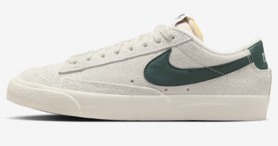a white, grey, and green women's Nike Blazer style shoe