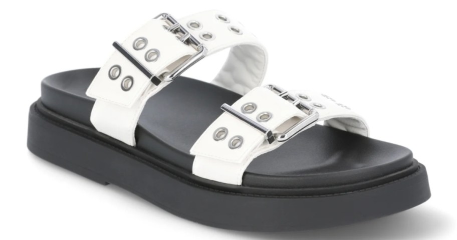 a women's footbed sandal with a black footbed and white and silver straps