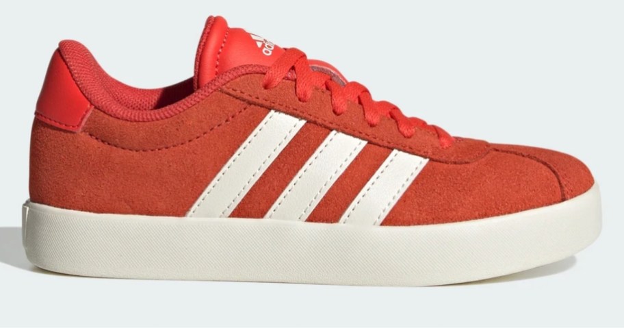 an orange and white kids adidas shoe