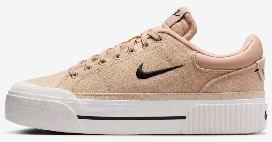tan and white women's Nike shoe