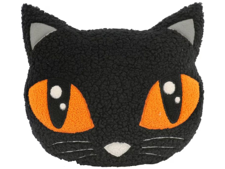 The face of a black cat as a throw pillow