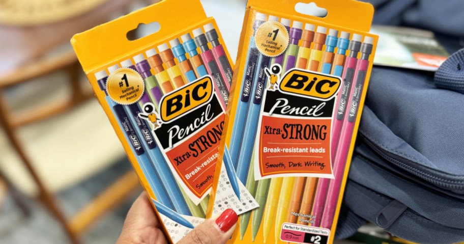 hand holding two boxes of BIC Xtra-Strong Mechanical Pencils