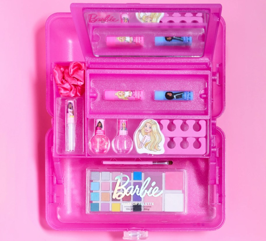 barbie themed makeup items inside a pink caboodles case