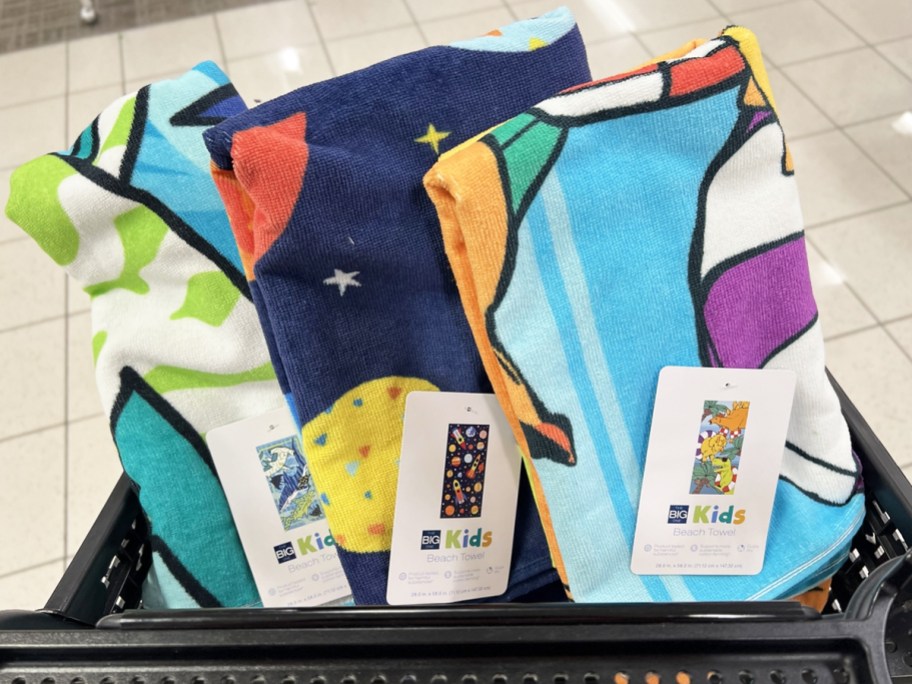 three kids beach towels in black shopping cart