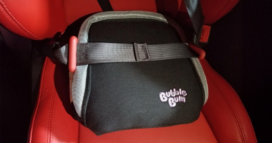 Bubble Bum Inflatable Booster Car Seat sitting in a red vehicle seat
