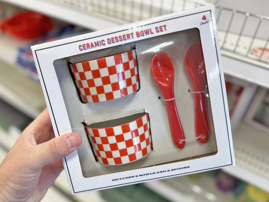 hand holding a red and white dessert bowl and spoon boxed set