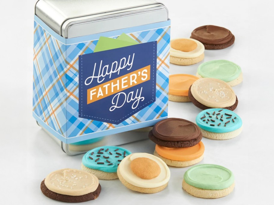  A festive tin with a plaid design and "Happy Father's Day" label surrounded by colorful frosted cookies in various flavors