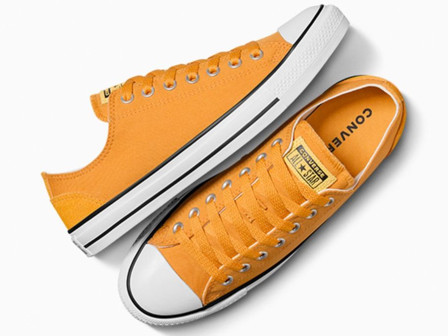 A pair of yellow Converse sneakers