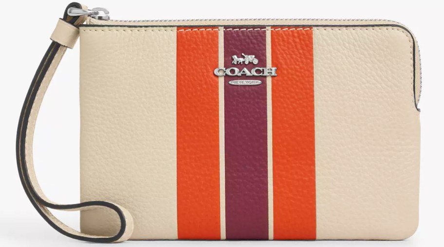 white coach wristlet with red and purple stripes